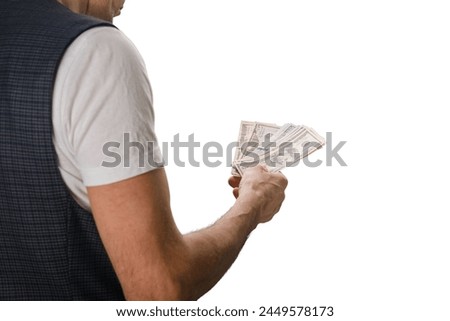 Closeup photo of man holding dollars cash isolated on white background, Financial transaction: Close-up of a man's hands holding cash dollars, isolated for commercial use