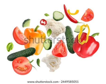 Fresh vegetables and herbs in air on white background
