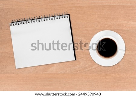 a Coffee and notebook on the wood background 