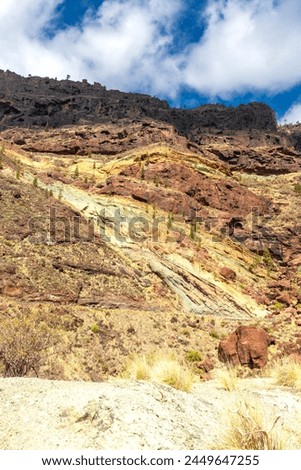 Azulejos de Veneguera or Rainbow Rocks Natural Monument in Mogan, Gran Canaria