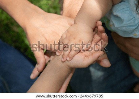 Family members holding hands in park with children childhood protection