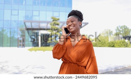 Young African American businesswoman telephoning