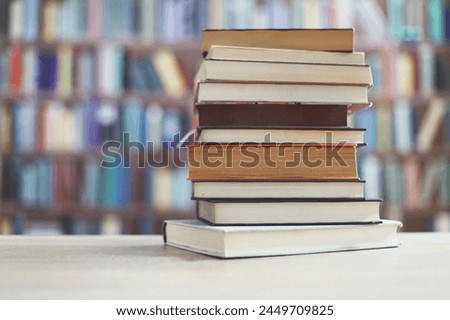 stack of books on wooden table