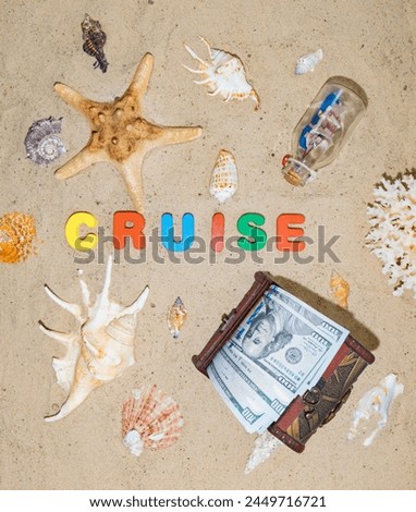 Money for cruise, journey, vacation, rest, holiday, dream, travel. A well-deserved vacation at an expensive seaside resort. Chest with dollars on the beach. The inscription in on the sand "Cruise" Royalty-Free Stock Photo #2449716721