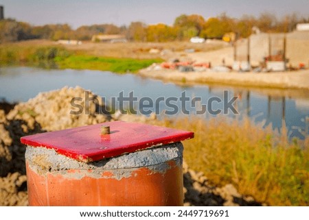 Red metal pole, side device, for determine level of bridge, 4 points for determining exact dimensions and check elevations. Construction of the bridge is in progress. Royalty-Free Stock Photo #2449719691
