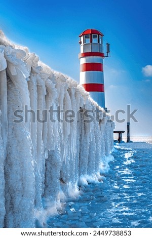 Impressive ice sculptures at the lighthouse in Neusiedl Lake Royalty-Free Stock Photo #2449738853