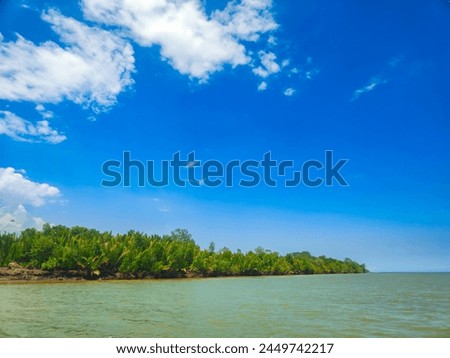 landscape photography of ocean atmosphere with a bright blue sky background