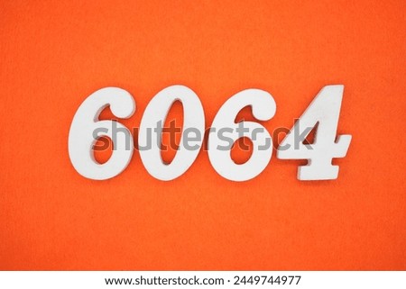 Orange felt is the background. The numbers 6064 are made from white painted wood.