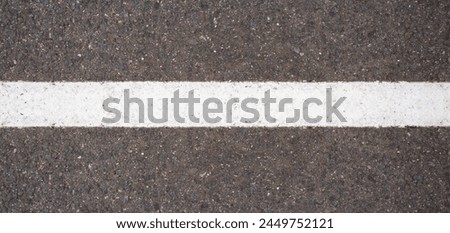 Empty highway black asphalt road and white dividing lines, Top view Royalty-Free Stock Photo #2449752121