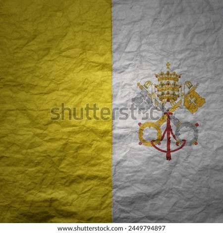 colorful big national flag of vatican city on a grunge old paper texture background