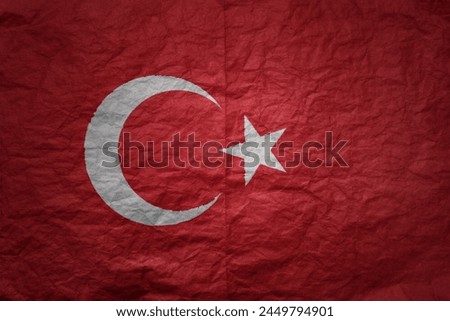 colorful big national flag of turkey on a grunge old paper texture background