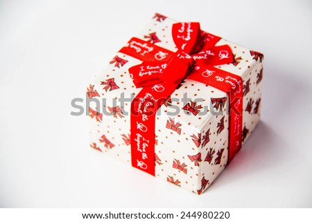 Gold gift box with  ribbon and bow isolated on white background.