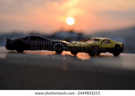 Sunset and model car two sun yellow and purple car models