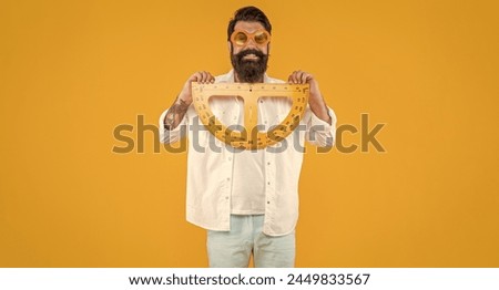 glad man hold geometry protractor on background. photo of man hold geometry protractor.