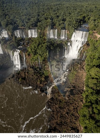 Beautiful aerial view to Iguazu Falls and green rainforest in the border of Brazil and Argentina