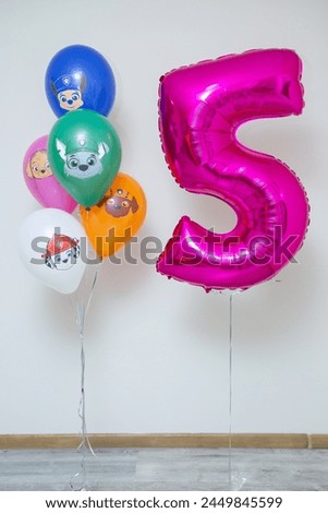Foil number five balloon and a bunch of bright balloons with animals