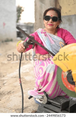 Portrait of an Indian woman working in a factory