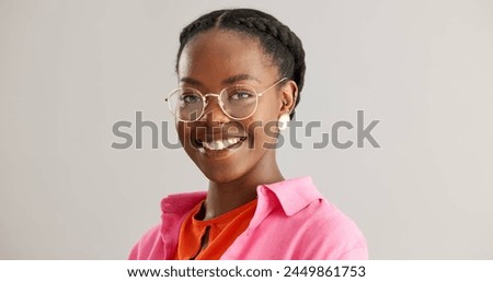 Black woman, glasses and portrait with smile in studio with fashion for vision, sight or eye care on grey background. Spectacles, confident and face of person with happiness, style and trendy clothes
