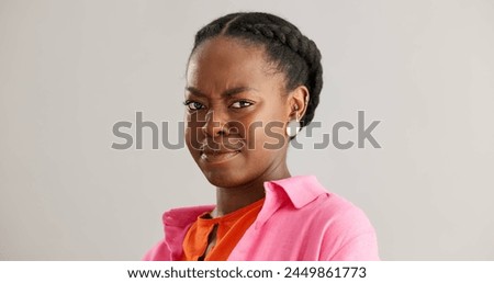 Woman, african and face with studio, disgust and cringe with reaction to news. Person, upset and gossip with emotion, wtf and negative or unhappy with omg look and unexpected notification and fail Royalty-Free Stock Photo #2449861773