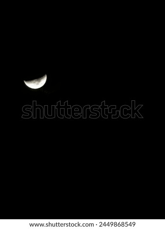 Crescent moon shot during the night gives a perfect example of white and black picture