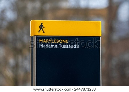 A pedestrian sign outside Madame Tussauds in Marylebone, London, UK.