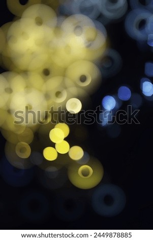 Abstract bokeh background. Golden bokeh circles on a dark blue background. Layer overlay.