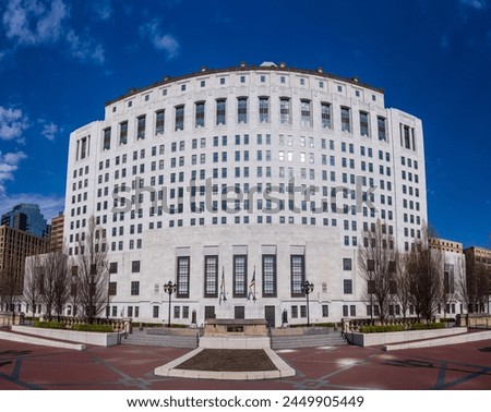 Wide angle panorama of the white marble entrance and facade to the Supreme Court of Ohio in Columbus with US flag flying