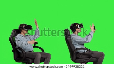 Disappointed player feeling angry about lost tournament online on virtual reality cyberspace, losing gaming championship against greenscreen backdrop. Woman getting furious after failure. Camera B. Royalty-Free Stock Photo #2449938331