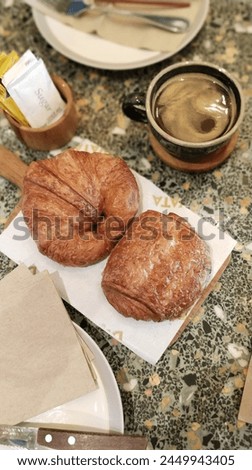 a picture of pastries and coffee in a local cafe
