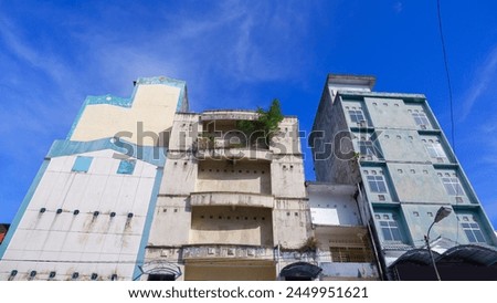 Tall Buildings In The City Of Pangkalpinang, With Bright Blue Sky, Photo Taken From Below, Indonesia