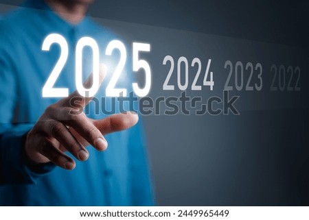 Happy New Year 2025, Hand touch on a virtual screen 2025, New Goals, Plans, and numbers for Next Year, Businessman touching future growth year 2024 to 2025, Planning, opportunity, business strategy.