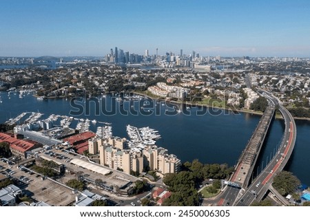 Sydney suburb of Drummoyne, city skyline and Parramatta river and Iron cove bridge.