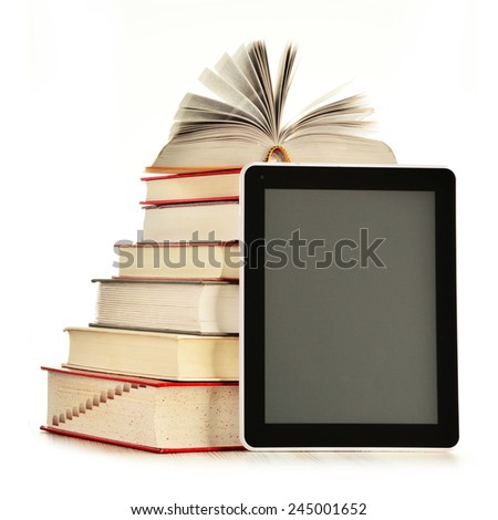 Composition with books and tablet computer isolated on white background
