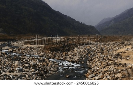 terai-dooars region of west bengal at dudhia. beautiful mountain stream (balason river) flowing through the valley, himalaya foothills area in india Royalty-Free Stock Photo #2450016825