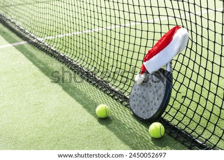 Christmas Open Padel Tournament. Poster for social networks for New Year's games. Padel tennis racket on tournament. paddle racket on court 
