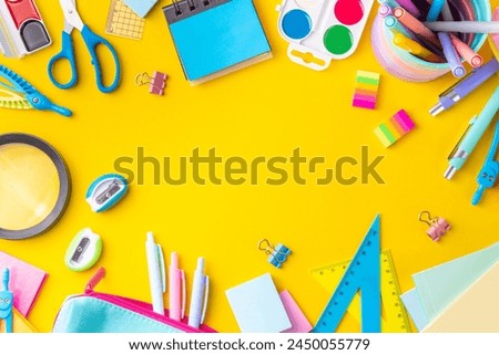 School equipment high-colored bright yellow flat lay. Various school education and office supplies, accessories. Back to school sale background top view copy space