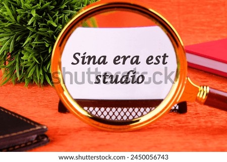 Sina era est studio It means Without anger and addiction through a magnifying glass on a business card. Business concept