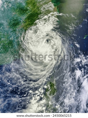 Typhoon Soulik 07W over Taiwan and China. Typhoon Soulik 07W over Taiwan and China. Elements of this image furnished by NASA. Royalty-Free Stock Photo #2450065215