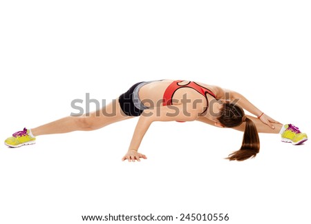Athletic caucasian fitness girl in sportswear stretching
