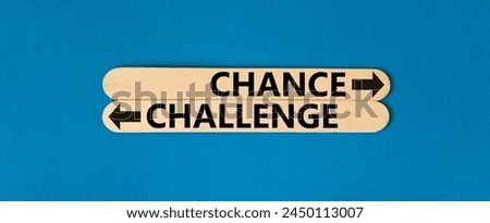 Challenge or chance symbol. Concept word Challenge or Chance on beautiful wooden stick. Beautiful blue table blue background. Business and challenge or chance concept. Copy space.
