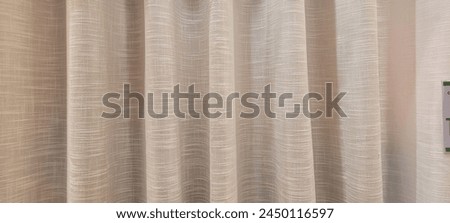 "Radiant and welcoming, this sunlit house curtain creates a warm and inviting atmosphere. Purchase this image and illuminate your projects with luminosity and comfort!" Royalty-Free Stock Photo #2450116597