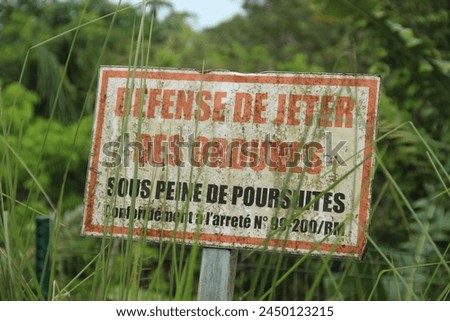 sign written in French on the border between Brazil and French Guiana