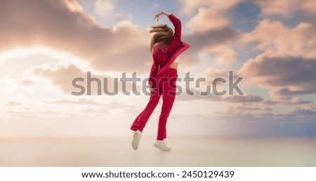 Beautiful Athletic Woman in Stylish Outfit Dancing Energetically in Studio with Sky Background. Creative Female Performing Contemporary Dance Choreography On Set During Virtual Production