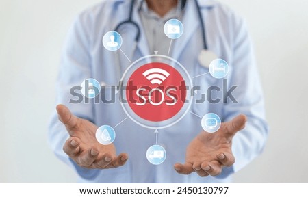 Innovative healthcare medical doctor holding SOS alert hologram healthcare icons, emergency services advanced medical assistance, modern telemedicine, urgent care, healthcare services, medical apps Royalty-Free Stock Photo #2450130797