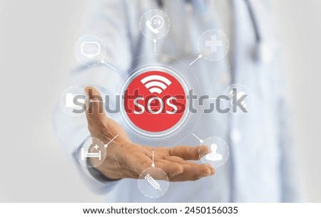 Innovative healthcare medical doctor holding SOS alert hologram healthcare icons, emergency services advanced medical assistance, modern telemedicine, urgent care, healthcare services, medical apps Royalty-Free Stock Photo #2450156035