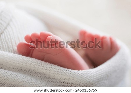 Little human baby newborn feet during newborn photoshoot child care