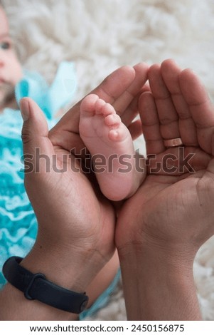 Little human baby newborn feet during newborn photoshoot child care