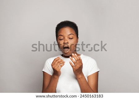Woman sneezing. Allergy or flu concept