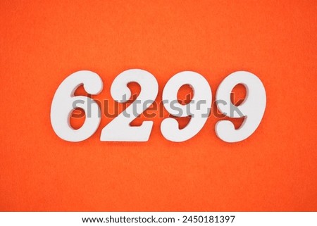 Orange felt is the background. The numbers 6299 are made from white painted wood.
