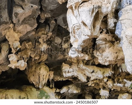 a photography of a cave with a small cave like structure.